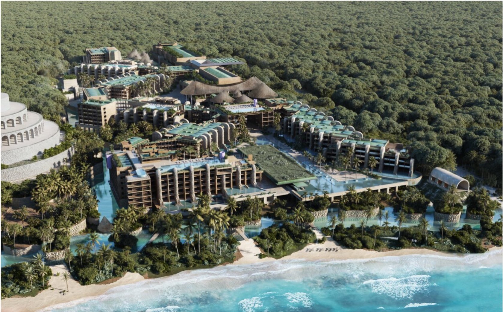 Aerial view of Hotel Xcaret Arte set in lush jungle running down to the Caribbean beach